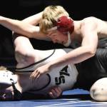Soldotna's Jacob Strausbaugh wrestles to victory against South's Bohdan Porter on Friday, Nov. 3, 2023, at Soldotna High School in Soldotna, Alaska. (Photo by Jeff Helminiak/Peninsula Clarion)