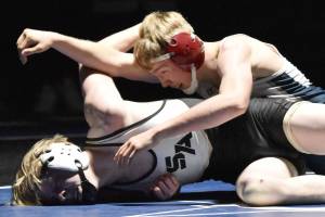 Soldotna's Jacob Strausbaugh wrestles to victory against South's Bohdan Porter on Friday, Nov. 3, 2023, at Soldotna High School in Soldotna, Alaska. (Photo by Jeff Helminiak/Peninsula Clarion)