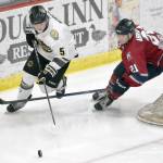 Blake Norris of the Kenai River Brown Bears tries to hold off Nolan Abraham of the Fairbanks Ice Dogs on Saturday, Nov. 4, 2023, at the Soldotna Regional Sports Complex in Soldotna, Alaska. (Photo by Jeff Helminiak/Peninsula Clarion)