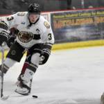 Nick Stevens of the Kenai River Brown Bears prepares to pop out in front of the net and score a power-play goal against the Fairbanks Ice Dogs on Saturday, Nov. 4, 2023, at the Soldotna Regional Sports Complex in Soldotna, Alaska. (Photo by Jeff Helminiak/Peninsula Clarion)