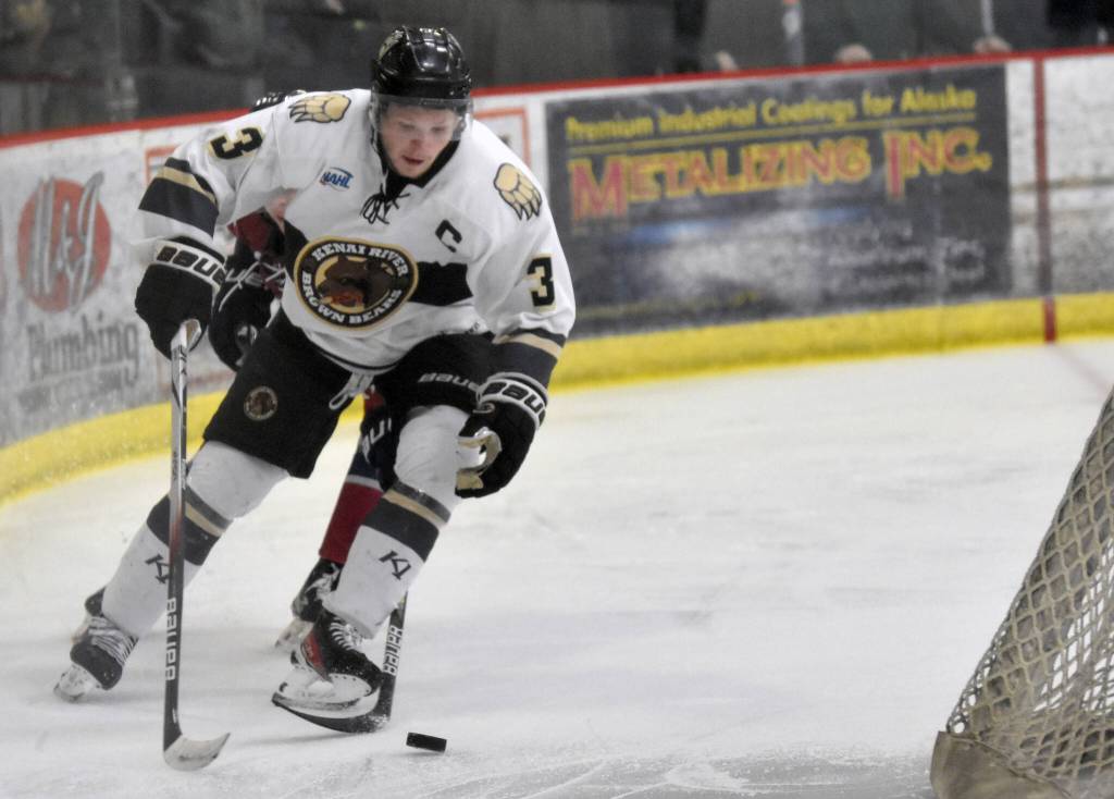 Nick Stevens of the Kenai River Brown Bears prepares to pop out in front of the net and score a power-play goal against the Fairbanks Ice Dogs on Saturday, Nov. 4, 2023, at the Soldotna Regional Sports Complex in Soldotna, Alaska. (Photo by Jeff Helminiak/Peninsula Clarion)