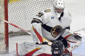 Kenai River Brown Bears goalie Owen Zenone makes a save against the Fairbanks Ice Dogs on Saturday, Nov. 4, 2023, at the Soldotna Regional Sports Complex in Soldotna, Alaska. (Photo by Jeff Helminiak/Peninsula Clarion)