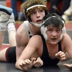 Soldotna's Titus Watts controls Kenai Central's Jaxson Young at 125 pounds during a dual meet Tuesday, Nov. 7, 2023, at Kenai Central High School in Kenai, Alaska. (Photo by Jeff Helminiak/Peninsula Clarion)