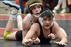 Soldotna's Titus Watts controls Kenai Central's Jaxson Young at 125 pounds during a dual meet Tuesday, Nov. 7, 2023, at Kenai Central High School in Kenai, Alaska. (Photo by Jeff Helminiak/Peninsula Clarion)