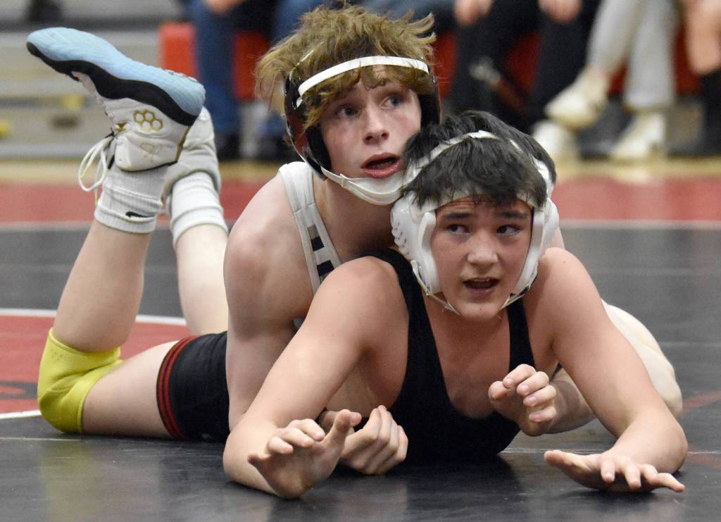 Soldotnas Titus Watts controls Kenai Centrals Jaxson Young at 125 pounds during a dual meet Tuesday, Nov. 7, 2023, at Kenai Central High School in Kenai, Alaska. (Photo by Jeff Helminiak/Peninsula Clarion)