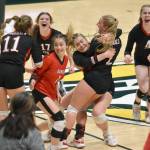 The Kenai Central volleyball team celebrates defeating Valdez for the Class 3A state title Saturday, Nov. 11, 2023, at the Alaska Airlines Center in Anchorage, Alaska. (Photo by Jeff Helminiak/Peninsula Clarion)