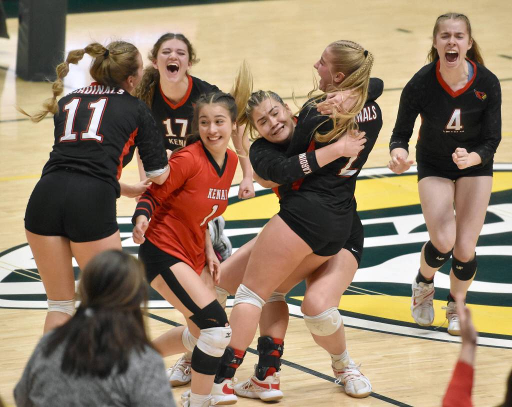 The Kenai Central volleyball team celebrates defeating Valdez for the Class 3A state title Saturday, Nov. 11, 2023, at the Alaska Airlines Center in Anchorage, Alaska. (Photo by Jeff Helminiak/Peninsula Clarion)