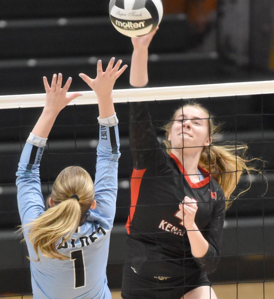 Kenai Centrals Avia Miller attacks against Valdezs Isabella Smelcer at the Class 3A state volleyball tournament Saturday, Nov. 11, 2023, at the Alaska Airlines Center in Anchorage, Alaska. (Photo by Jeff Helminiak/Peninsula Clarion)