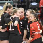 The Kenai Central volleyball team regroups before a set at the Class 3A state volleyball tournament Saturday, Nov. 11, 2023, at the Alaska Airlines Center in Anchorage, Alaska. (Photo by Jeff Helminiak/Peninsula Clarion)