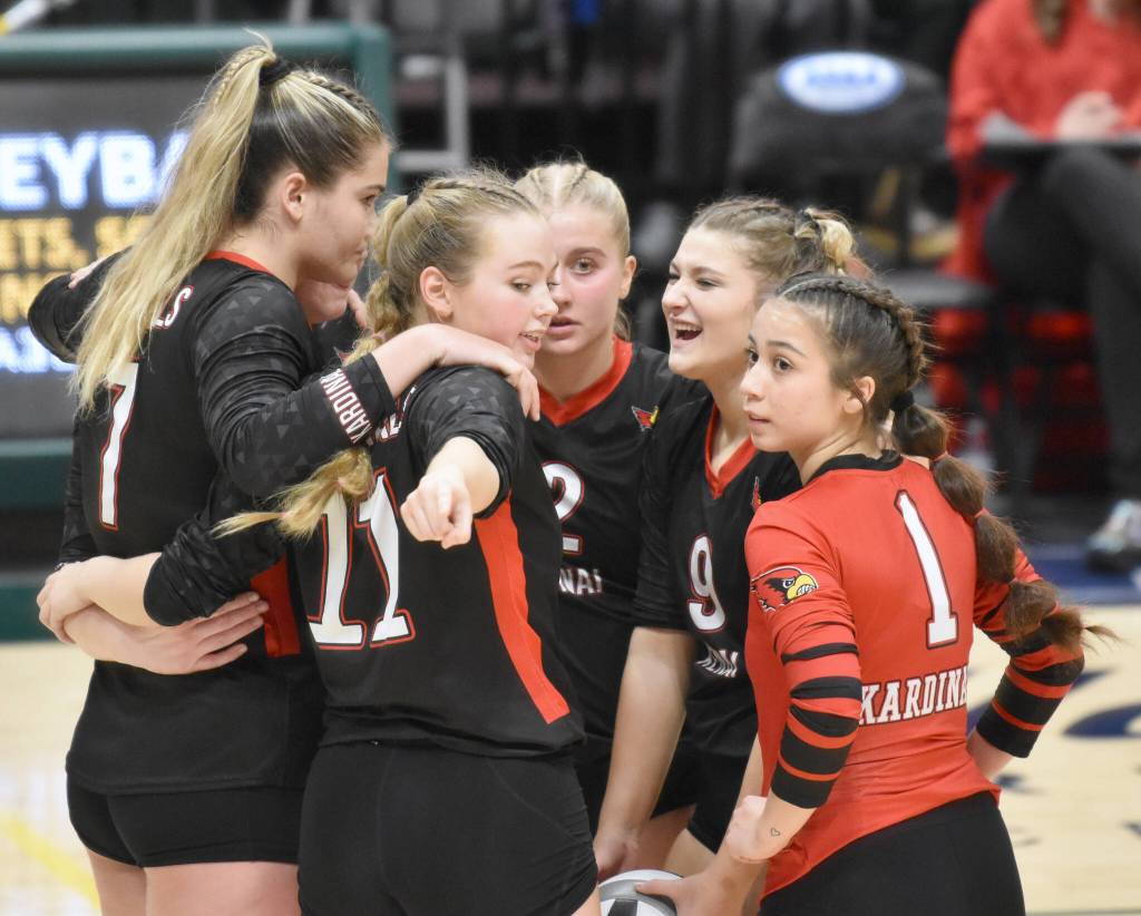 The Kenai Central volleyball team regroups before a set at the Class 3A state volleyball tournament Saturday, Nov. 11, 2023, at the Alaska Airlines Center in Anchorage, Alaska. (Photo by Jeff Helminiak/Peninsula Clarion)