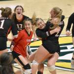 The Kenai Central volleyball team celebrates defeating Valdez for the Class 3A state title Saturday, Nov. 11, 2023, at the Alaska Airlines Center in Anchorage, Alaska. (Photo by Jeff Helminiak/Peninsula Clarion)
