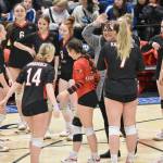 Kenai Central celebrates during a timeout at the Class 3A state volleyball tournament Saturday, Nov. 11, 2023, at the Alaska Airlines Center in Anchorage, Alaska. (Photo by Jeff Helminiak/Peninsula Clarion)
