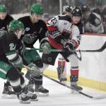 Jackson Ebbott of the Kenai River Brown Bears advances the puck past Nick Hatton and Joe Kelly of the Chippewa (Wisconsin) Steel on Sunday, Nov. 12, 2023, at the Soldotna Regional Sports Complex in Soldotna, Alaska. (Photo by Jeff Helminiak/Peninsula Clarion)