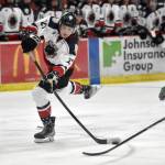 Kenai River Brown Bears forward Landon MacDonald shoots the puck against the Chippewa (Wisconsin) Steel on Sunday, Nov. 12, 2023, at the Soldotna Regional Sports Complex in Soldotna, Alaska. (Photo by Jeff Helminiak/Peninsula Clarion)