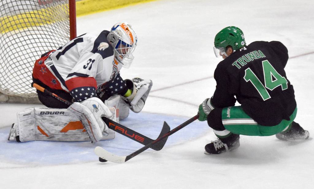 Kenai River goaltender Marks Slavinskis-Repe saves a breakaway attempt by Tomas Trunda of the Chippewa (Wisconsin) Steel on Sunday, Nov. 12, 2023, at the Soldotna Regional Sports Complex in Soldotna, Alaska. (Photo by Jeff Helminiak/Peninsula Clarion)