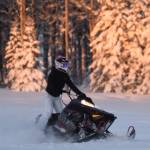 A snowmachine rider takes advantage of two feet of fresh snow on a field down Murwood Avenue in Soldotna, Alaska on Monday, Dec. 12, 2022. (Jake Dye/Peninsula Clarion)