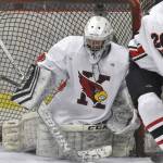 Kenai Central's Seanna Swanson scrambles to make a save while Cole Langham and Kylee Verkuilen hold off Palmer's Elijah Von Gunten on Thursday, Nov. 16, 2023, during Kenai River Cup play at the Kenai Multi-Purpose Facility in Kenai, Alaska. (Photo by Jeff Helminiak/Peninsula Clarion)