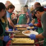 Thanksgiving dinners are assembled at the Kenai Senior Center in Kenai, Alaska, on Friday, Nov. 17, 2023. (Jake Dye/Peninsula Clarion)