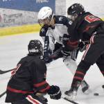 Juneau-Douglas: Yadaa.at Kales Carter Miller holds Soldotnas Riley Cronin off the puck Friday, Nov. 17, 2023, at the Soldotna Regional Sports Complex in Soldotna, Alaska. (Photo by Jeff Helminiak/Peninsula Clarion)