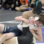 Soldotna junior Hunter Bras tries to score early points during a sudden victory win over South Anchorages Clayton McGuire in the 145-pound final of the Lancer Smith Memorial on Saturday, Nov. 18, 2023, at the Menard Arena in Wasilla, Alaska. (Photo by Jeremiah Bartz/Frontiersman)