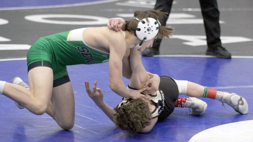 Seward junior Tommy Jamig tries to get a reversal against South Anchorages Dylan Frawner during the 103-pound final of the Lancer Smith Memorial on Saturday, Nov. 18, 2023, at the Menard Arena in Wasilla, Alaska. (Photo by Jeremiah Bartz/Frontiersman)