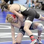 Soldotna junior Jacob Strausbaugh battles Soth Anchorages Jacob Morris during the 125-pound final of the Lancer Smith Memorial on Saturday, Nov. 18, 2023, at the Menard Arena in Wasilla, Alaska. (Photo by Jeremiah Bartz/Frontiersman)