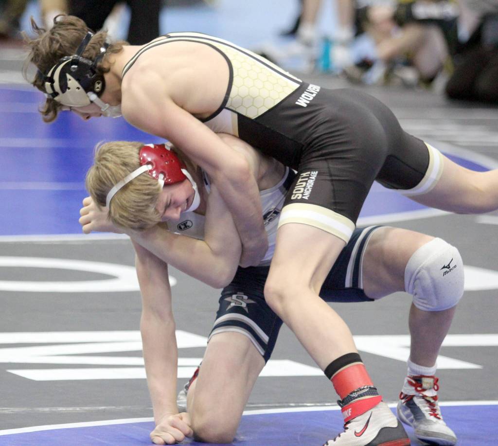 Soldotna junior Jacob Strausbaugh battles Soth Anchorages Jacob Morris during the 125-pound final of the Lancer Smith Memorial on Saturday, Nov. 18, 2023, at the Menard Arena in Wasilla, Alaska. (Photo by Jeremiah Bartz/Frontiersman)