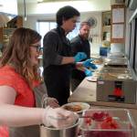 Jesse Lamm, Coltin Yancey and Chef Stephen Lamm plate and serve the Thanksgiving meal at the Kenai Peninsula Food Bank in Soldotna, Alaska, on Wednesday, Nov. 22, 2023. (Jake Dye/Peninsula Clarion)