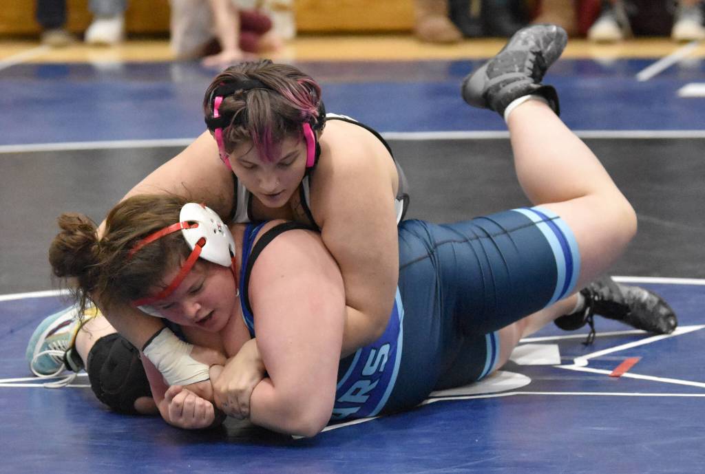 Nikiskis Destiny Langston and Soldotna Meg Roberts battle at 235 pounds Tuesday, Nov. 21, 2023, at Soldotna High School in Soldotna, Alaska. Roberts won 7-4. (Photo by Jeff Helminiak/Peninsula Clarion)