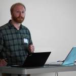 Bryant Wright speaks about the decisions facing the in-development Kahtnu Area Transit during a public meeting at the Challenger Learning Center of Alaska in Kenai, Alaska, on Wednesday, Nov. 29, 2023. (Jake Dye/Peninsula Clarion)