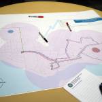 A preliminary Kenai route for the Kahtnu Area Transit sits ready for comment alongside markers and sticky notes at the Challenger Learning Center of Alaska in Kenai, Alaska, on Wednesday, Nov. 29, 2023. (Jake Dye/Peninsula Clarion)