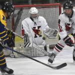 Kenai Centrals Seanna Swanson and Sawyer Vann look to block a shot Thursday, Nov. 30, 2023, at the Kenai Multi-Purpose Facility in Kenai, Alaska. (Photo by Jeff Helminiak/Peninsula Clarion)