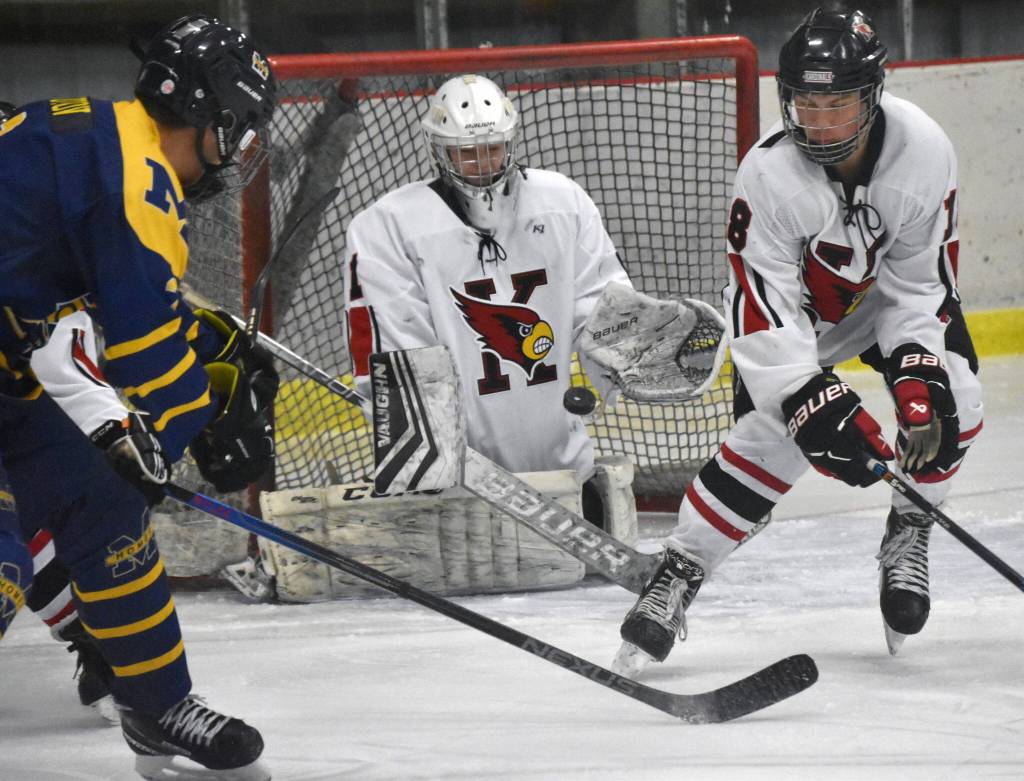 Kenai Centrals Seanna Swanson and Sawyer Vann look to block a shot Thursday, Nov. 30, 2023, at the Kenai Multi-Purpose Facility in Kenai, Alaska. (Photo by Jeff Helminiak/Peninsula Clarion)