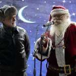 Kenai Peninsula Borough Mayor Peter Micciche and Santa Claus speak to attendees of Christmas in the Park at Soldotna Creek Park in Soldotna, Alaska, on Saturday, Dec. 2, 2023. (Jake Dye/Peninsula Clarion)