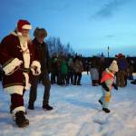 Santa Claus leads the crowd to the tree lighting during Christmas in the Park at Soldotna Creek Park in Soldotna, Alaska, on Saturday, Dec. 2, 2023. (Jake Dye/Peninsula Clarion)