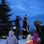 Kenai Peninsula Borough Mayor Peter Micciche, Santa Claus and Nugget count down to the lighting of the tree during Christmas in the Park at Soldotna Creek Park in Soldotna, Alaska, on Saturday, Dec. 2, 2023. (Jake Dye/Peninsula Clarion)