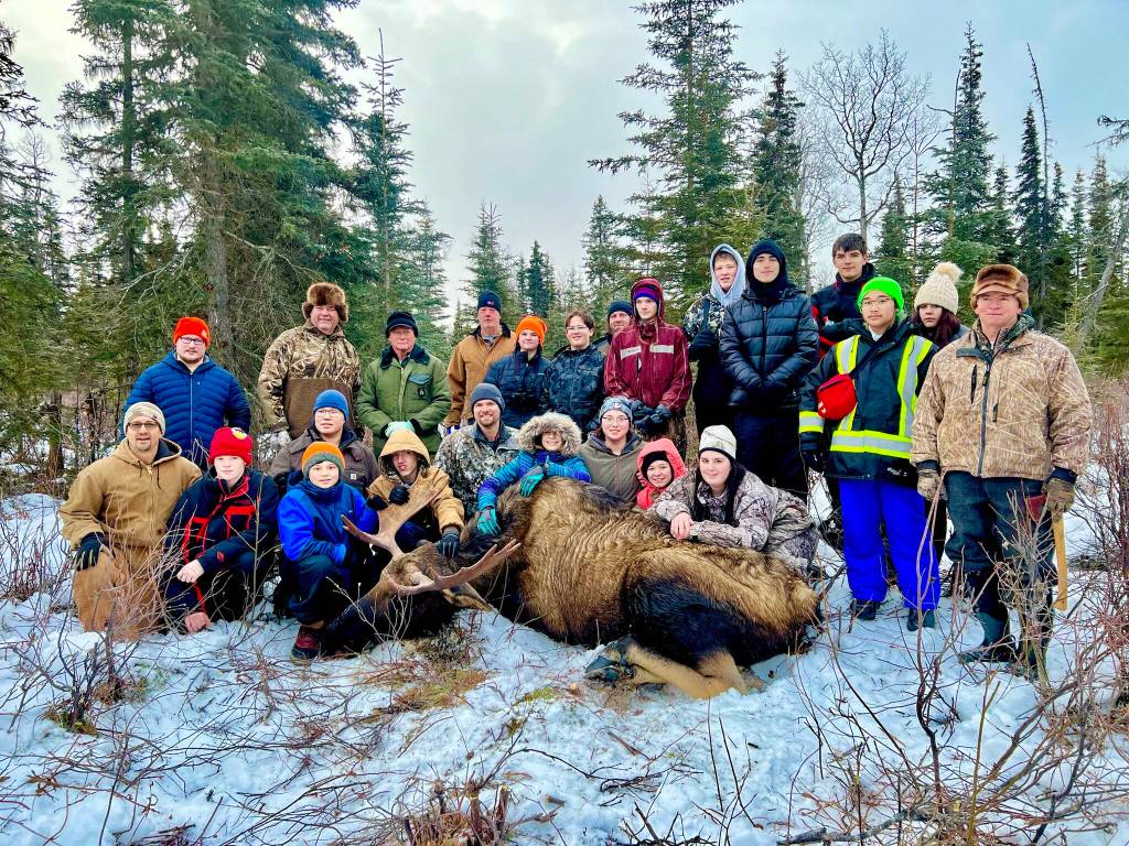 Students from Nikiski Middle/High School and Kenai Middle School join Jesse Bjorkman, Ken Felchle and volunteers from the Kenai Peninsula Chapter of Safari Club International on an educational moose hunt in Nikiski, Alaska, on Saturday, Dec. 2, 2023. (Photo provided by Jesse Bjorkman)