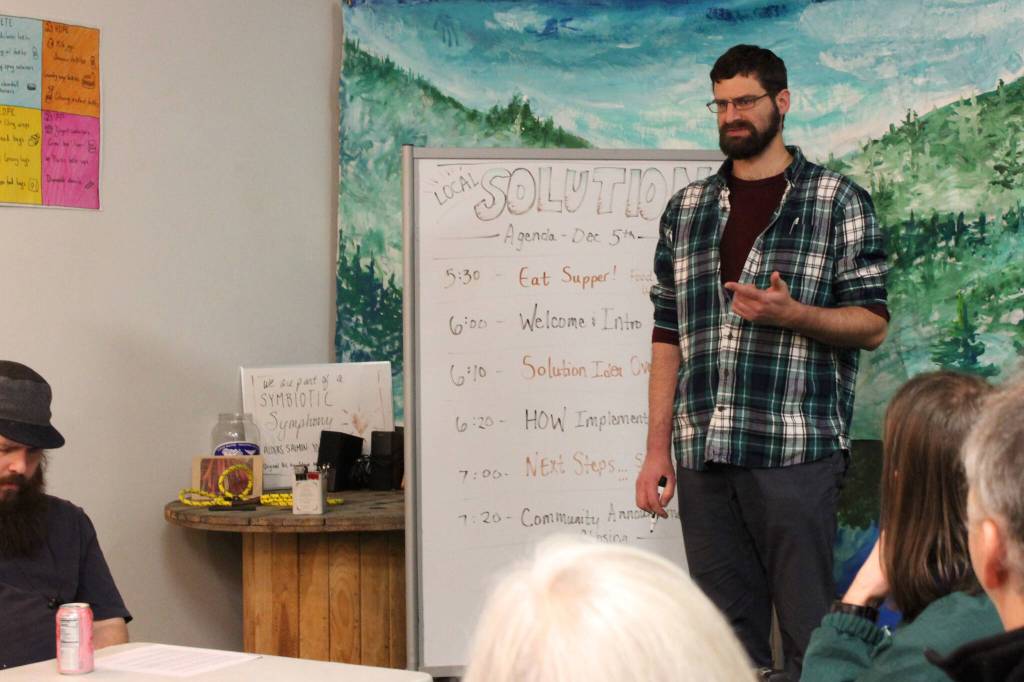 Cook Inletkeeper Energy Policy Analyst Ben Boettger presents information about retrofitting homes to be more energy efficient at the Cook Inletkeeper Community Action Studio on Tuesday, Dec. 5, 2023, in Soldotna, Alaska. (Ashlyn OHara/Peninsula Clarion)