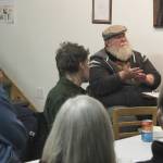 Larry Opperman (second from right) speaks during a community meeting about retrofitting homes to be more energy efficient at the Cook Inletkeeper Community Action Studio on Tuesday, Dec. 5, 2023, in Soldotna, Alaska. (Ashlyn OHara/Peninsula Clarion)