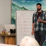 Cook Inletkeeper Energy Policy Analyst Ben Boettger presents information about retrofitting homes to be more energy efficient at the Cook Inletkeeper Community Action Studio on Tuesday, Dec. 5, 2023, in Soldotna, Alaska. (Ashlyn OHara/Peninsula Clarion)
