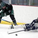 Soldotna’s Riley Cronin tries to keep the puck aweay from Colony’s Allen Baldwin after falling to the ice during a 4-3 loss to the Knights on Saturday, Dec. 8, 2023, at the Menard Arena in Wasilla, Alaska. (Photo by Bruce Eggleston/matsusports.net)