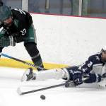 Soldotnas Riley Cronin tries to keep the puck aweay from Colonys Allen Baldwin after falling to the ice during a 4-3 loss to the Knights on Saturday, Dec. 8, 2023, at the Menard Arena in Wasilla, Alaska. (Photo by Bruce Eggleston/matsusports.net)