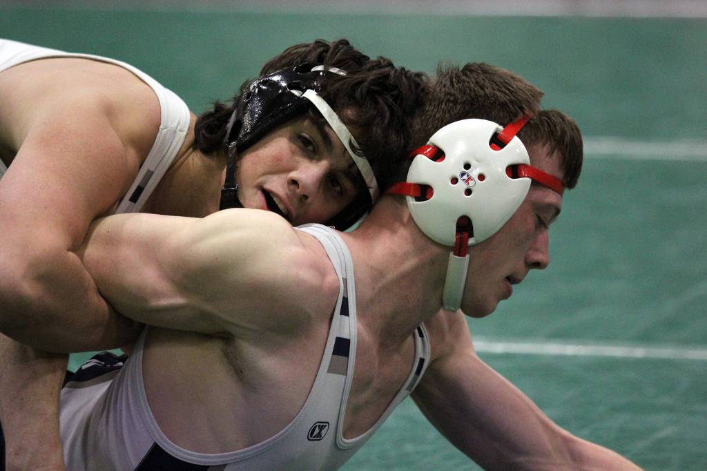 Soldotnas Bowen Korth maintains a grasp on teammate Collin Peck during the 171-pound final of the Northern Lights Conference Championships on Saturday, Dec. 9, 2023, at Colony High School in Palmer, Alaska. (Photo by Jeremiah Bartz/Frontiersman)