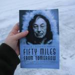 A copy of William L. Iġġiaġruk Hensleys Fifty Miles from Tomorrow is held outside the Peninsula Clarion building on Tuesday, Dec. 12, 2023 in Kenai, Alaska. (Ashlyn OHara/Peninsula Clarion)