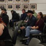 Audience members listen to Iris Fontana, of the Satanic Temple, deliver an invocation during a Kenai Peninsula Borough Assembly meeting on Tuesday, Dec. 12, 2023, in Soldotna, Alaska. Fontana was the last person to deliver an assembly invocation before a new borough policy, which says only borough volunteer chaplains may deliver the invocation, takes effect. (Ashlyn OHara/Peninsula Clarion)