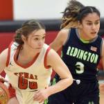 Kenai Central's Sierra Hershberger brings the ball up against Redington's Saydi Cardoso on Thursday, Dec. 14, 2023, at the Craig Jung Tournament at Kenai Central High School in Kenai, Alaska. (Photo by Jeff Helminiak/Peninsula Clarion)