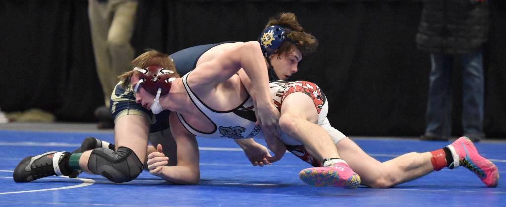 Homers Brayden Woods wrestles to a 6-1 loss to Wrangells Keegan Hanson in the Division II finals at 152 pounds Saturday, Dec. 16, 2023, at the state wrestling tournament at the Alaska Airlines Center in Anchorage, Alaska. (Photo by Jeff Helminiak/Peninsula Clarion)