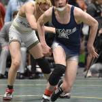 Soldotnas Jacob Strausbaugh escapes from Souths Jacob Morris on the way to an 18-5 victory in the Division I title match at 125 pounds Saturday, Dec. 16, 2023, at the state wrestling tournament at the Alaska Airlines Center in Anchorage, Alaska. (Photo by Jeff Helminiak/Peninsula Clarion)