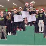 Seward celebrates winning the Division II state wrestling title Saturday, Dec. 16, 2023, at the state wrestling tournament at the Alaska Airlines Center in Anchorage, Alaska. (Photo by Jeff Helminiak/Peninsula Clarion)