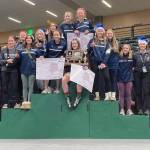 Soldotna celebrates winning the girls state wrestling title Saturday, Dec. 16, 2023, at the state wrestling tournament at the Alaska Airlines Center in Anchorage, Alaska. (Photo by Jeff Helminiak/Peninsula Clarion)
